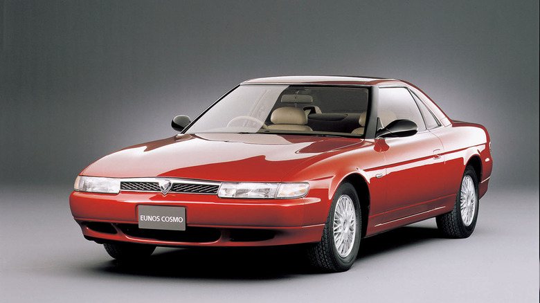 Red Mazda Eunos Cosmo grand tourer with a rotary engine