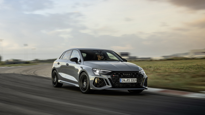 The latest Audi RS3 in gray on the racetrack, front 3/4 view