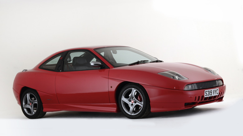 The Fiat Coupe in red, front 3/4 view, studio shot