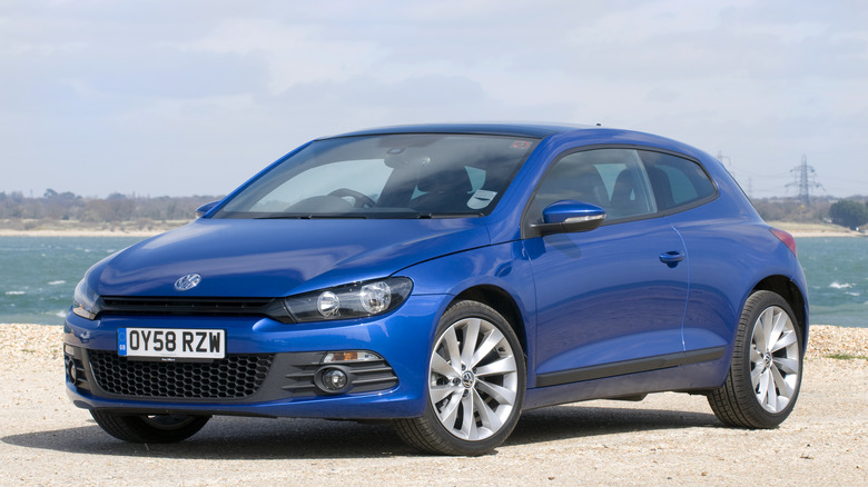 A blue third generation Volkswagen Scirocco, front 3/4 view