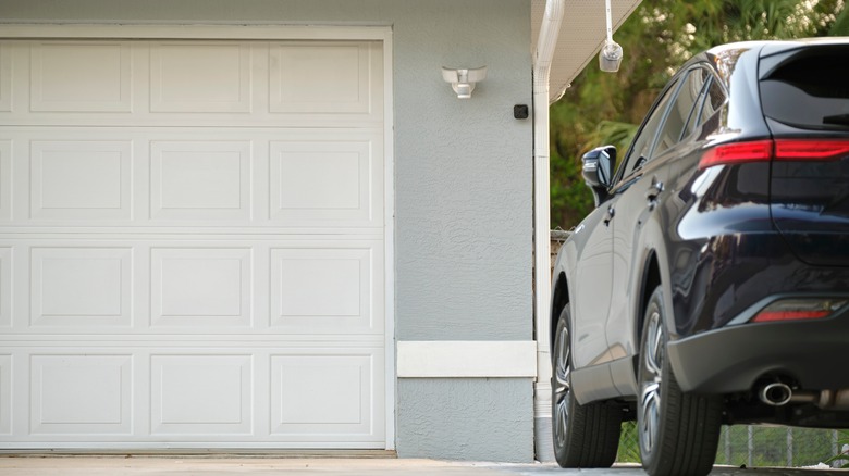 Car parked by garage