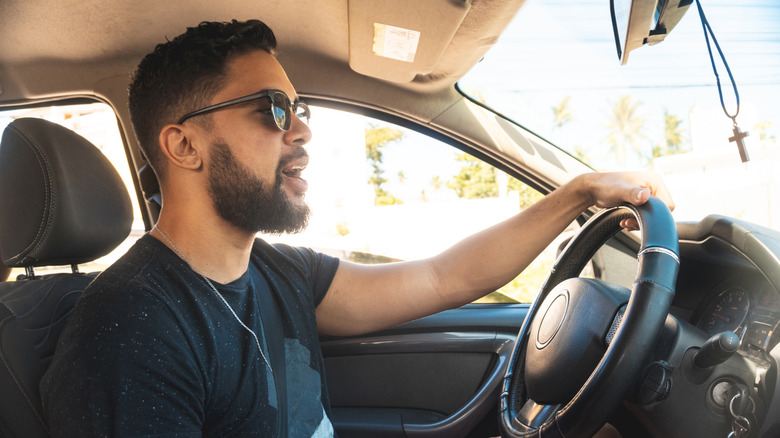 Man talks to voice assistant in car