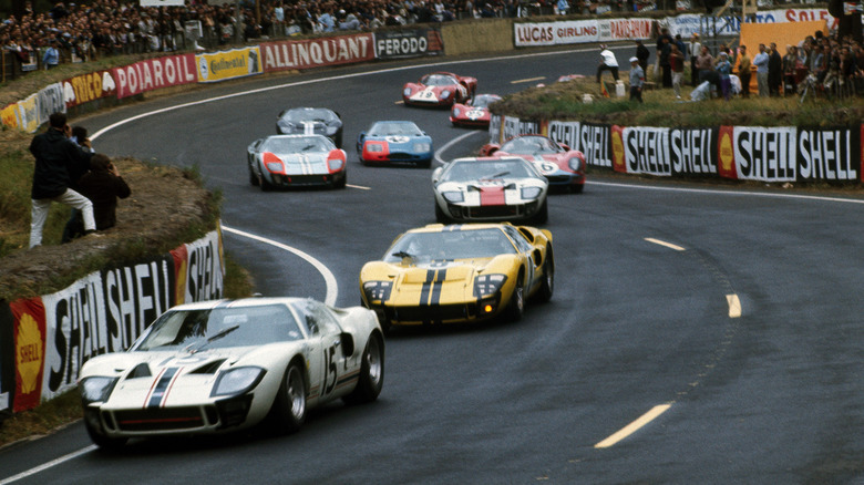 Three Ford GT40 prototypes leading the Le Mans race