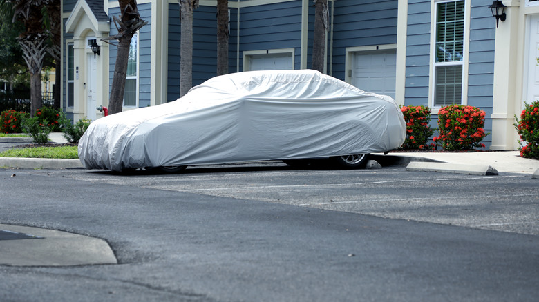 A car covered in a parking space