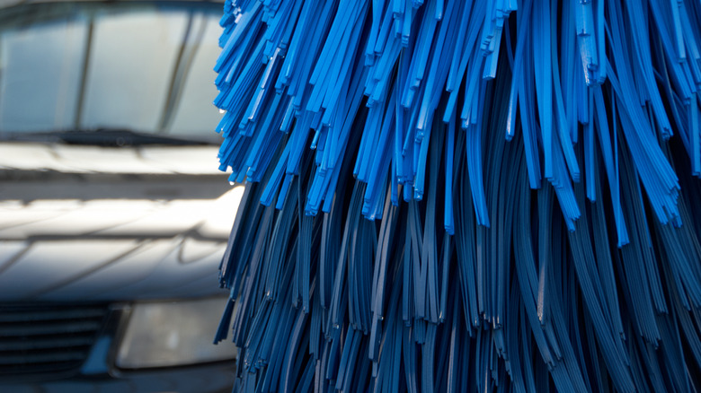 A car wash side brush preparing to wash a car