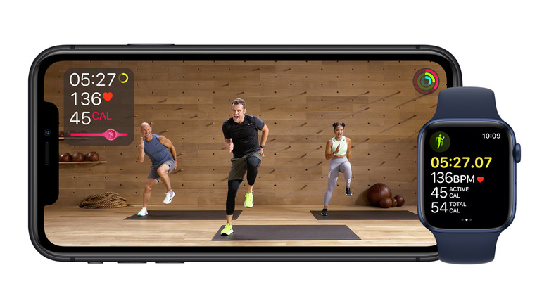 Apple Fitness+ running on a horizontal smartphone and an Apple Watch