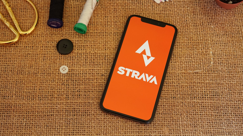 The Strava app running on two side-by-side Apple Watches