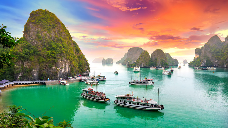 sunset view of boats in Ha Long Bay, Vietnam