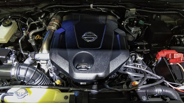 a Nissan YS23DDTT Engine under the hood of a car.