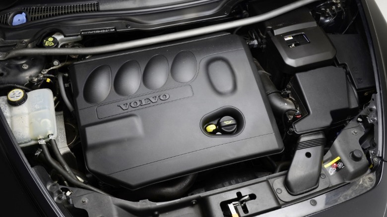 a Volvo engine under the hood of a car.