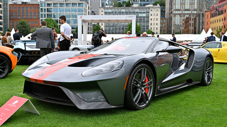 The second generation Ford GT at a car show, front 3/4 view, gray with red stripes