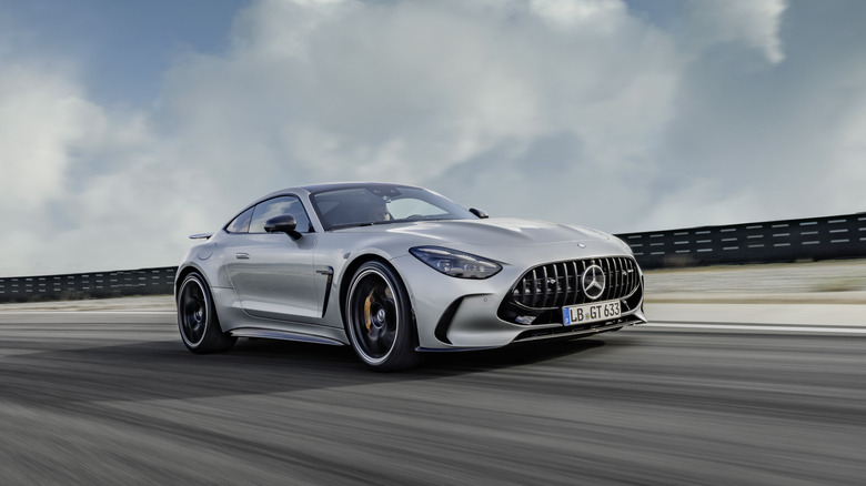 The new Mercedes-AMG GT on the move on a racetrack, front 3/4 view