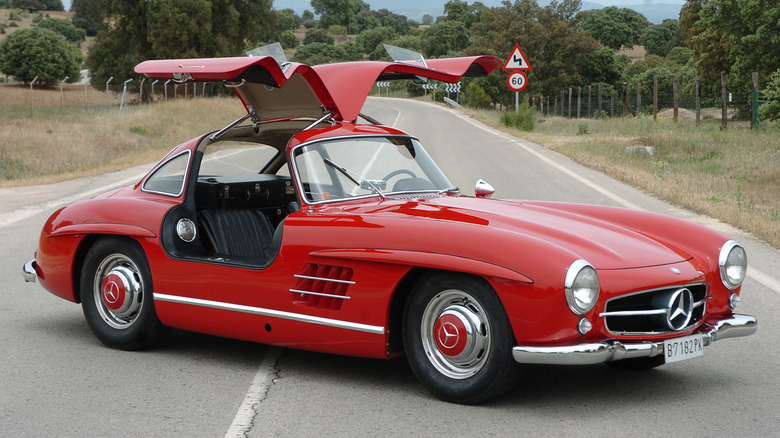 A Mercedes-Benz 300 SL Gullwing has its doors open.