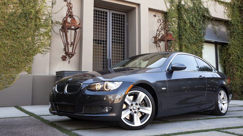 A gray E92 BMW 335i, front 3/4 view