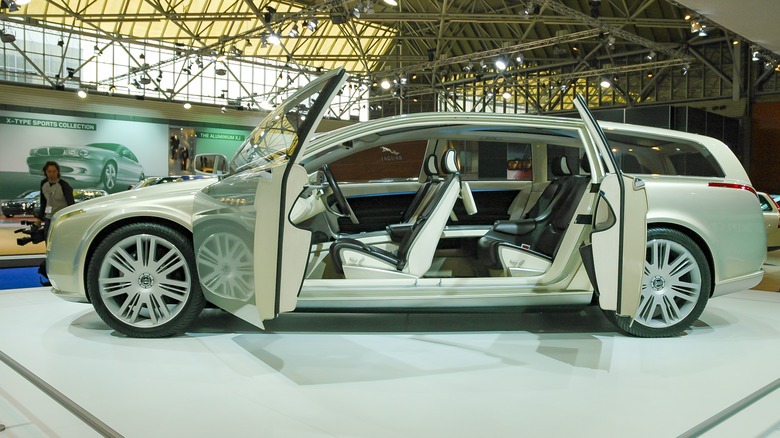 car with suicide doors open at showroom