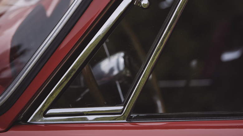 small vent window on red car door