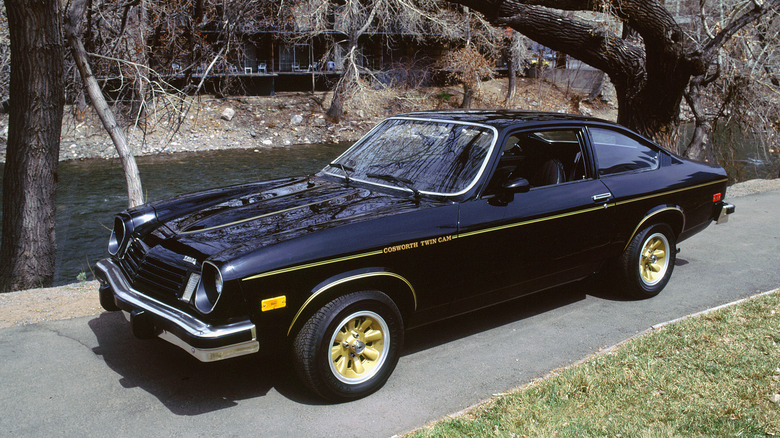 Black Chevrolet Corvair by river