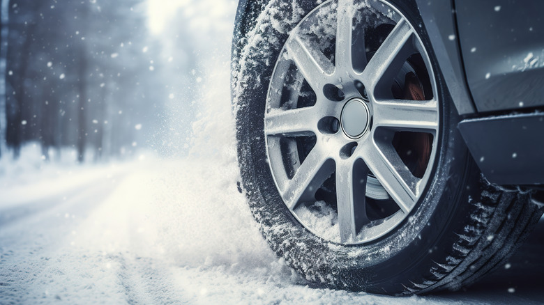 Car tire on snowy road