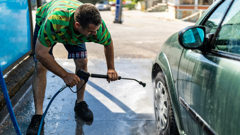 Man washes car