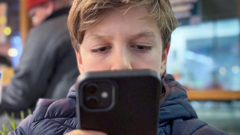 Young boy using smartphone