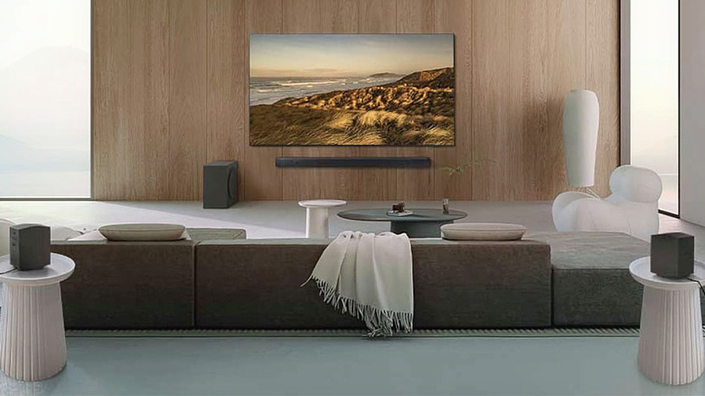 A Samsung Q990D 11.1.4 Soundbar system on display in a living room.