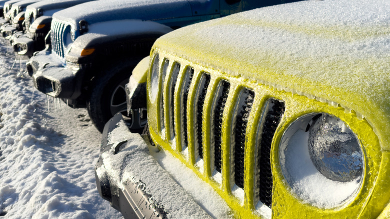 Vehicles surrounded by snow