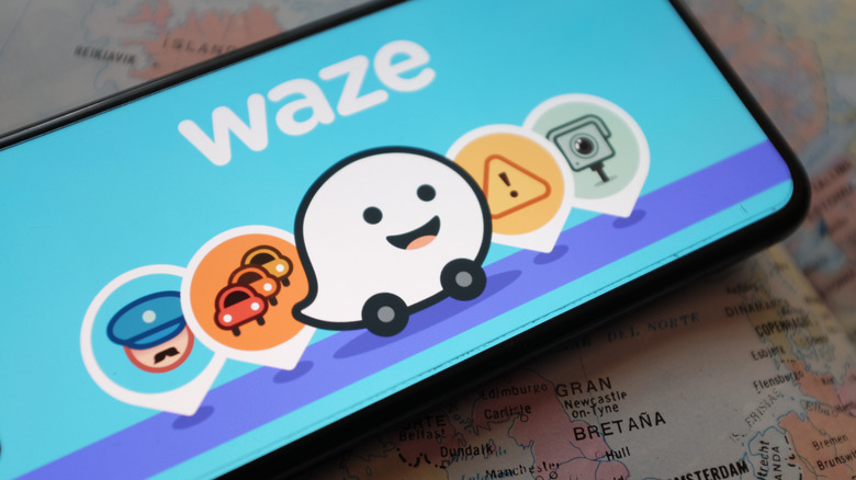 Smartphone with Waze app logo