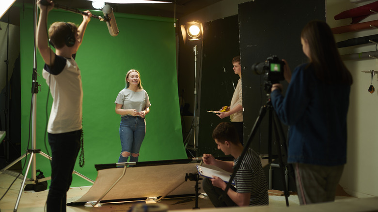 Students using a green screen