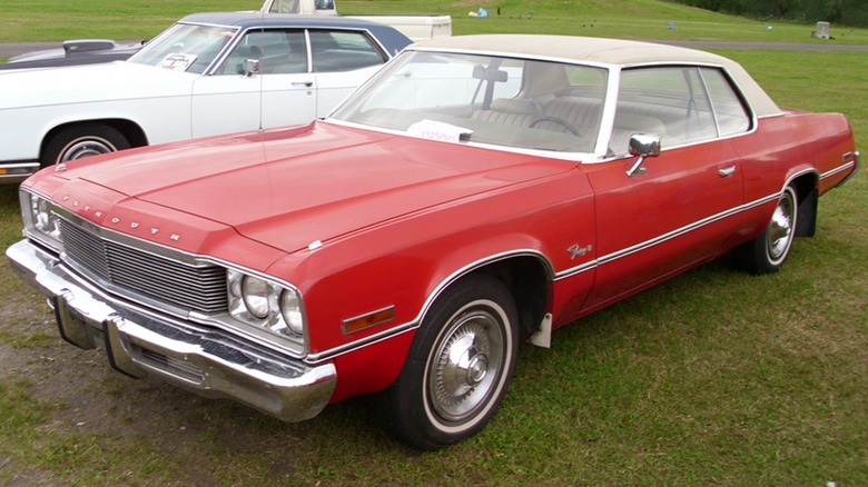 1974 plymouth fury parked grass lawn