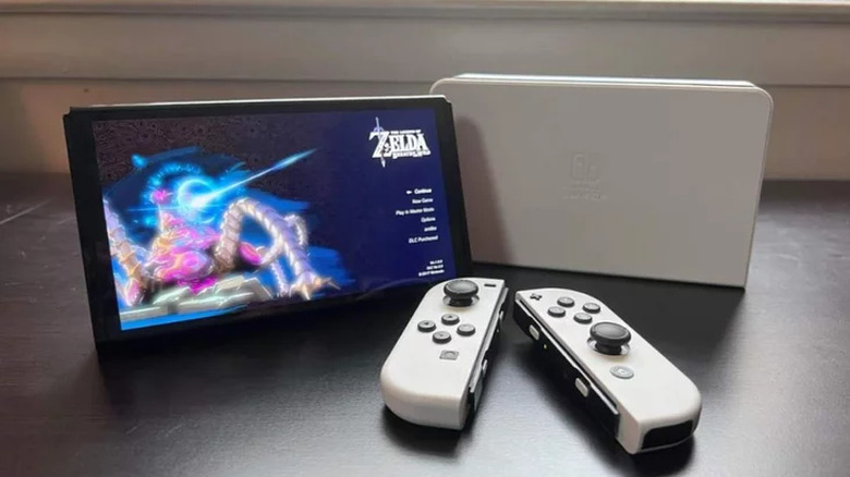 A Nintendo Switch OLED sitting on a desk