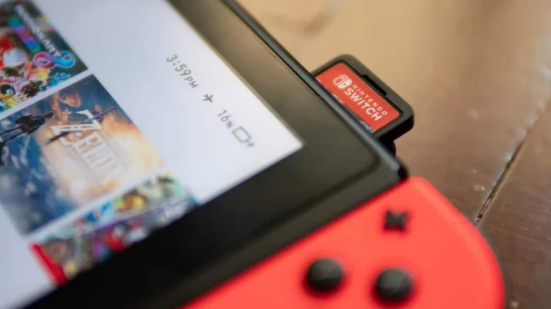 A Nintendo Switch game card partially inserted into the console