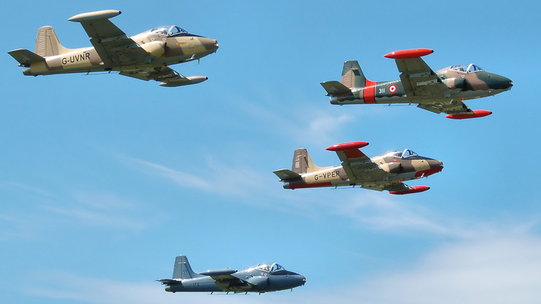 Four BAC Strikemasters flying in formation