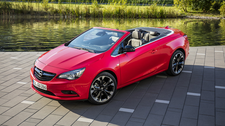 The Opel Cascada in red, front 3/4 view, roof down