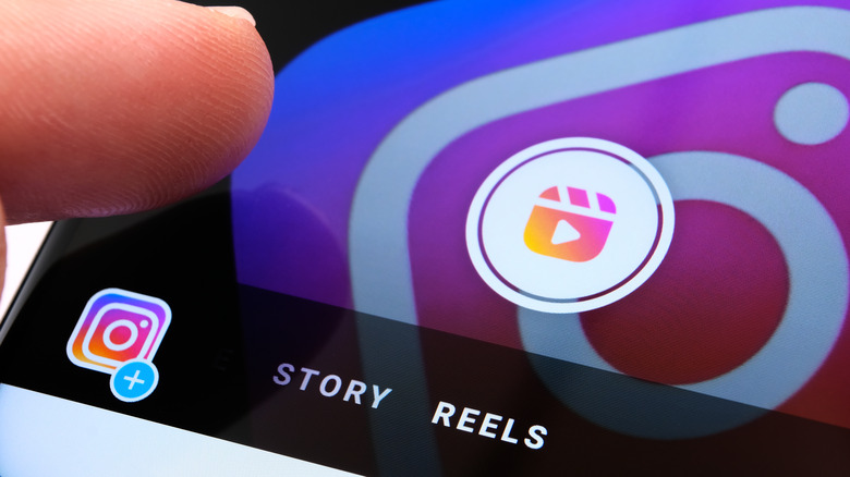 finger pressing Instagram Reels icon