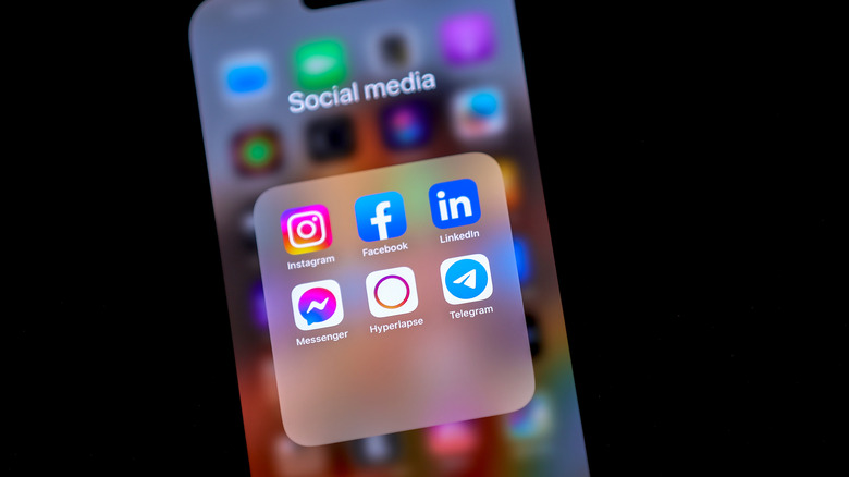 Social media app icons on phone