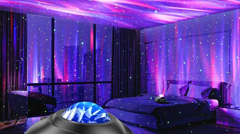 Bedroom with purple, pink, and blue lights on the floors, walls, and ceiling