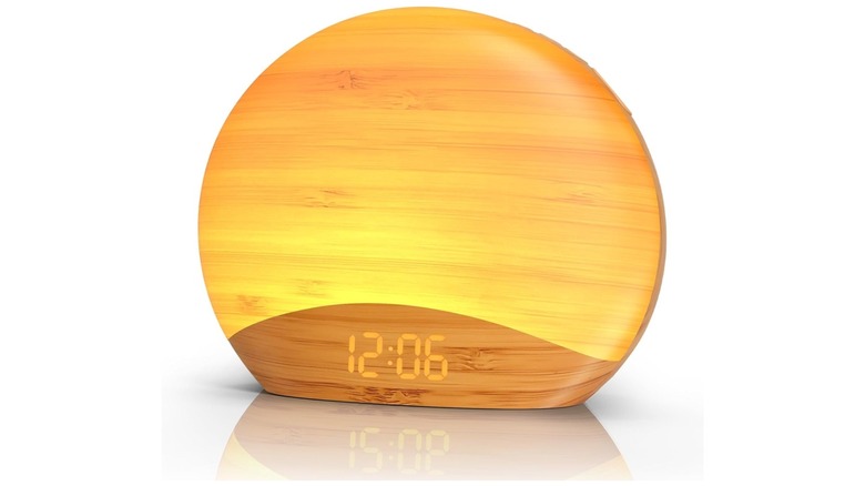 Glowing alarm clock displaying the time 12:06