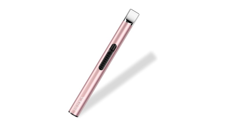 Long metallic pink device with a black button