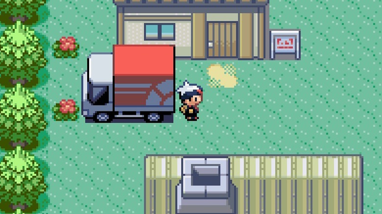 Character standing by a van in Pokémon Ruby