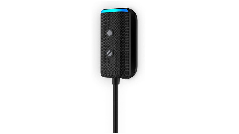 Black electronic speaker device with a long black powercord