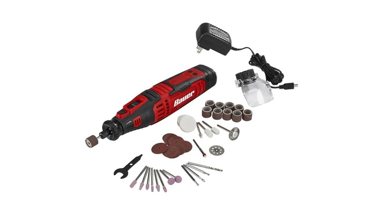 Black and red handheld rotary tool with a variety of bits and attachments