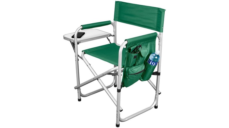 Green folding camping chair with attached table