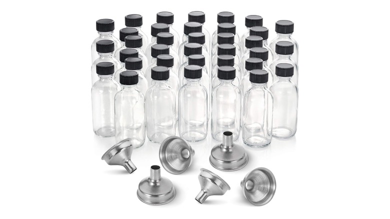 Collection of glass bottles with black caps