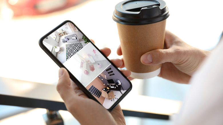 man monitoring house on smartphone