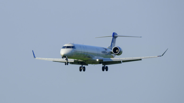 A passenger jet flying through the air