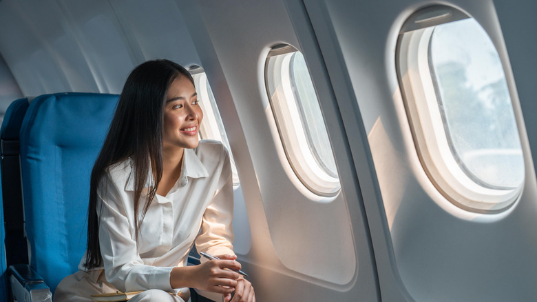 Woman sitting on an airline seat