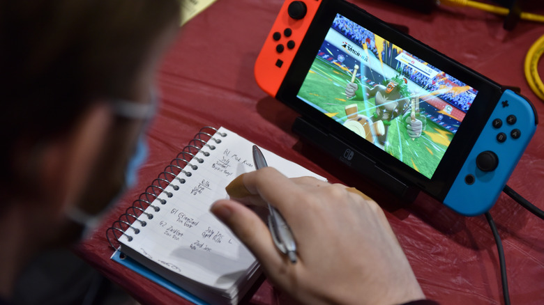 Taking notes while playing on the Nintendo Switch.