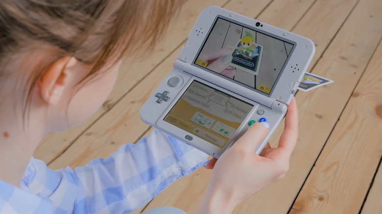 Woman using AR feature Nintendo 3DS