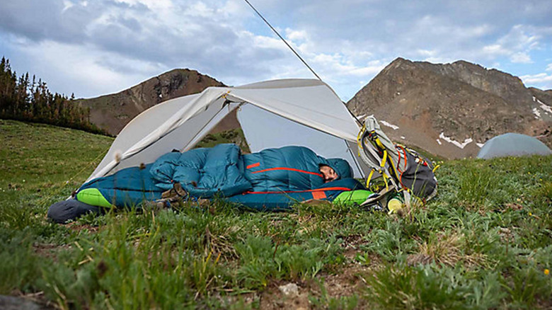 camper in a sleeping bag