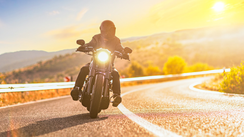 motorcycle road sunset